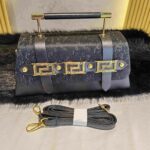 Elegant Designer Handbag with Gold Tone Details-Black